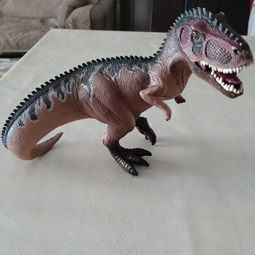 Set of 24 dinosaur figures in various sizes