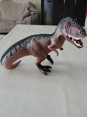 Set of 24 dinosaur figures in various sizes