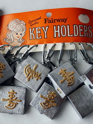 Card with 12 key holders metal cases from 1970s new
