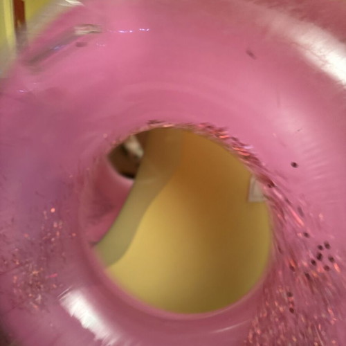 Pink inflatable pool float with glitter