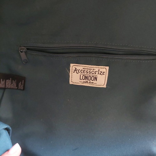 Back Pack Accesorize like new with side pockets and zipper