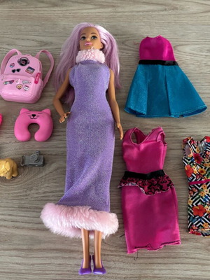 Barbie Travel in Style doll used with accessories and dresses