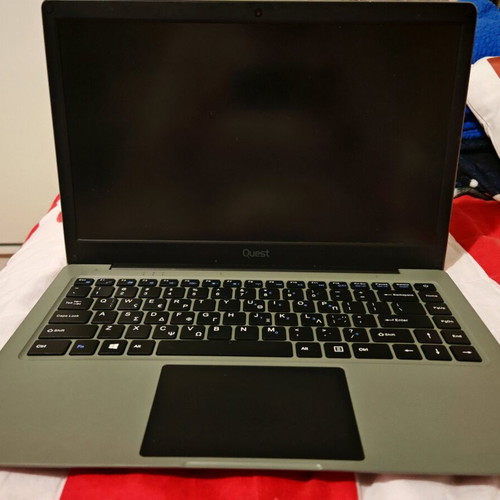 Quest Slimbook Plus 14.1" FHD laptop used with mouse and bag