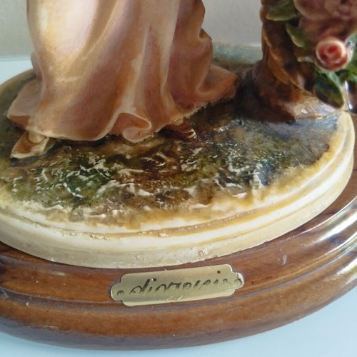 Vintage Italian decorative statue of a girl with roses, used