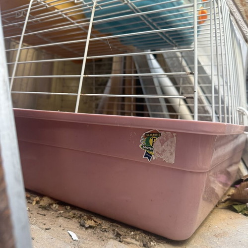 Rabbit cage and enclosure with food, bedding, and accessories used
