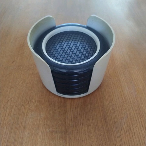 Plastic coasters used, set of 5 with holder