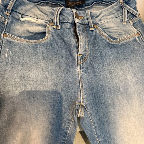 Fifty Carat jeans like new with knee rips size 28