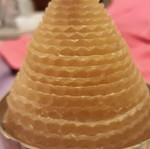 Solid brass candlestick with beeswax candle used