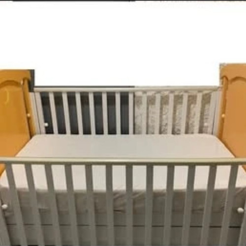 Children's cot and mattress used with drawer and adjustable rails