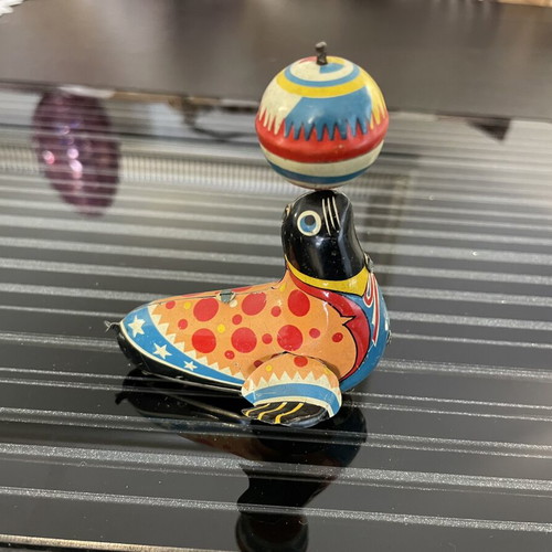 Seal with spinning ball vintage tin toy used