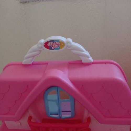 Dollhouse like new with furniture, portable suitcase design