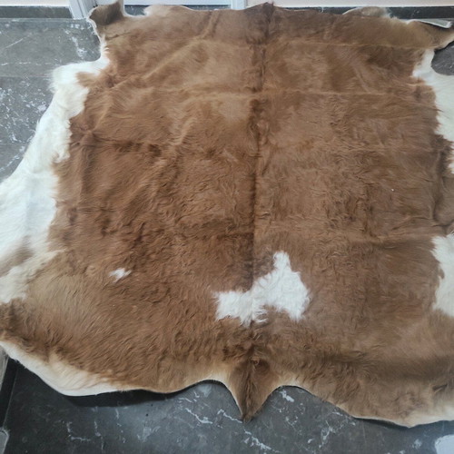 Cowhide rug like new, brown with white