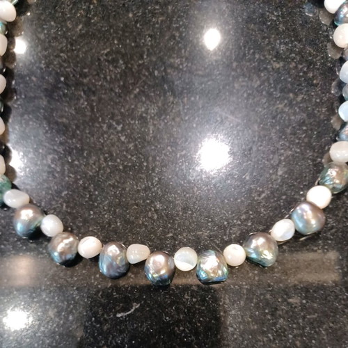 Necklace with white and olive stones, carved clasp, like new