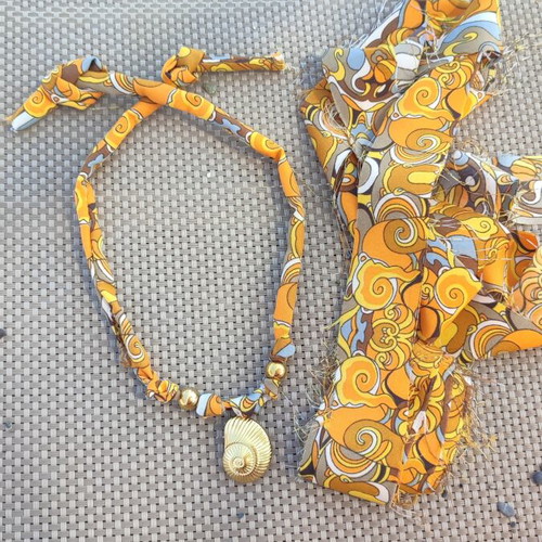 Summer necklace with steel elements on fabric strip