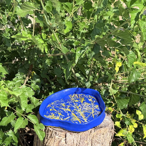 Handmade clay dish with floral design