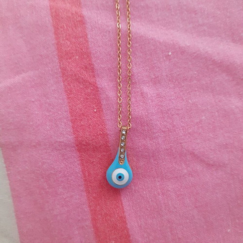 Steel necklace new with eye and decorative blue stones
