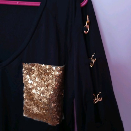 Black elastic blouse with sequin pocket and cutout, like new