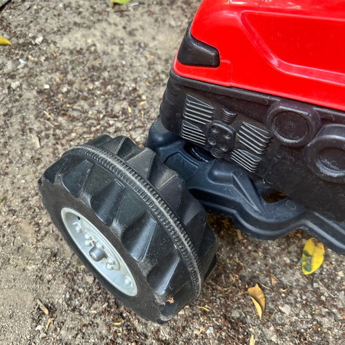 Small red pedal tractor for kids like new