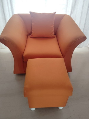 Armchair with footstool and cushion, orange
