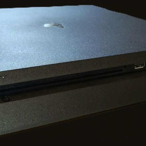Sony PlayStation 4 Slim 1TB console used with 2 DualShock controllers and 14 games