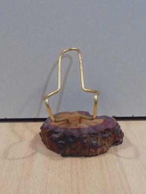 Metal decorative pipe stand used on wooden base