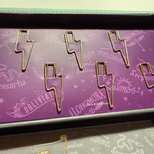 Harry Potter stationery set with pen, weekly planners, post-its, and lightning bolt clips