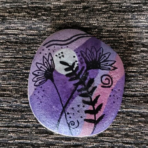 Painted stone new with acrylic colors and glossy varnish