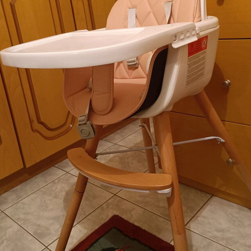 Kikaboo high chair like new with leather seat and wooden legs