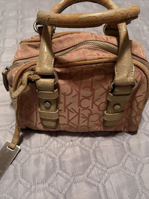 Calvin Klein pink handbag used with worn leather repairable