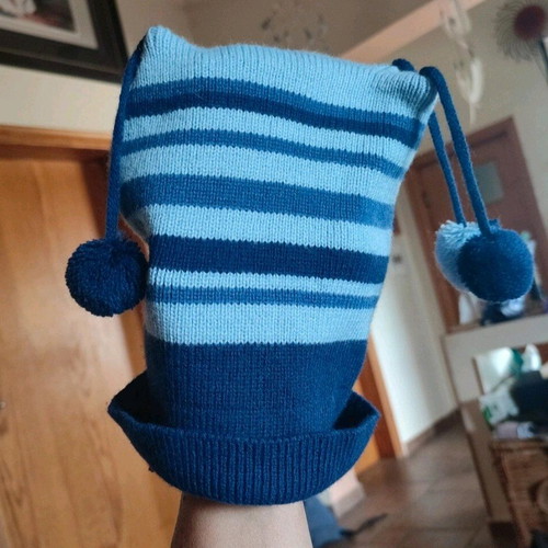 Knitted striped kids hat used, blue and turquoise