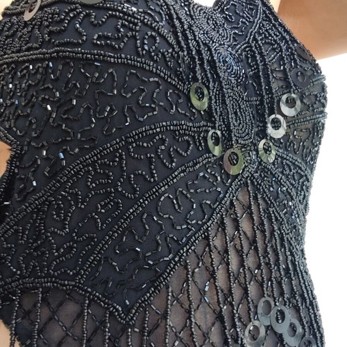Top with birds and beads like new, black, sizes S and M