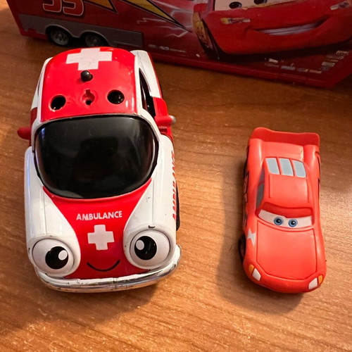 Ambulance toy car used with opening doors and pull-back mechanism