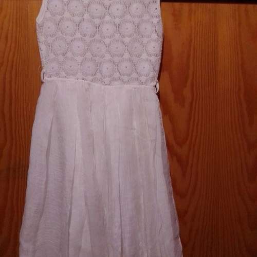 Two white dresses used, sizes 12-14 for girls