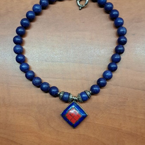 Necklace with blue semi-precious stones and silver setting like new