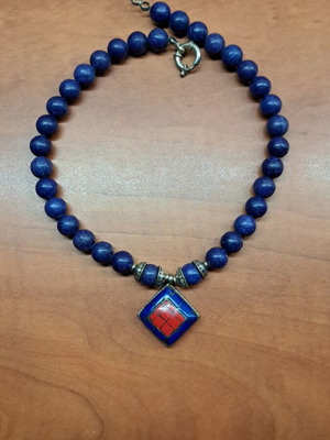Necklace with blue semi-precious stones and silver setting like new