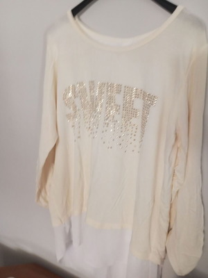 Women's blouse with rhinestone details and bow