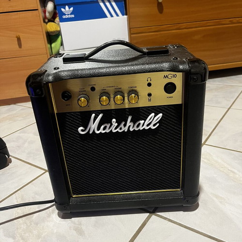 Fender Squier electric guitar with Marshall 24W amp and accessories