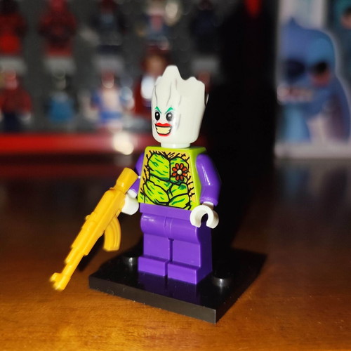 The Groot Who Laughs figure like new with stand and gold AR