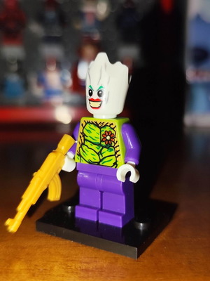 The Groot Who Laughs figure like new with stand and gold AR