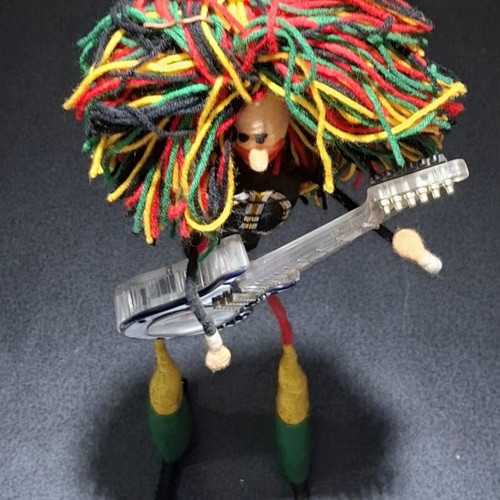 Vintage Table Clock Rastaman Figurine with Guitar like new