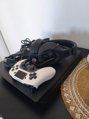 PlayStation 4 Pro 1TB like new with headset and extra controller