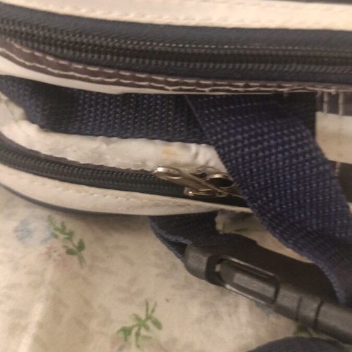 Insulated backpack with bottle holder like new, black and white striped
