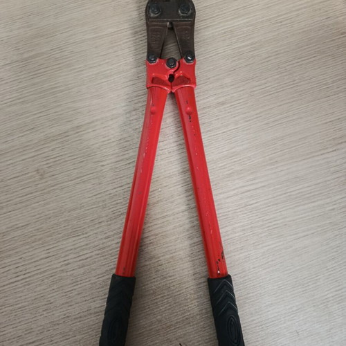 Bolt cutter with red handles and anti-slip grips