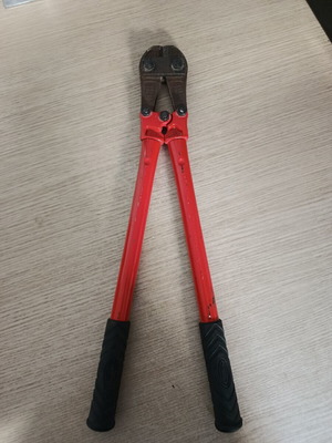 Bolt cutter with red handles and anti-slip grips