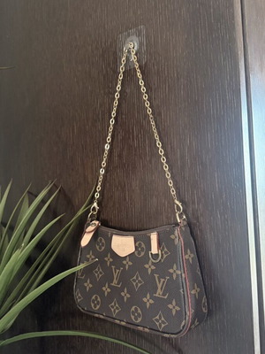 Louis Vuitton small handheld bag, leather, elegant