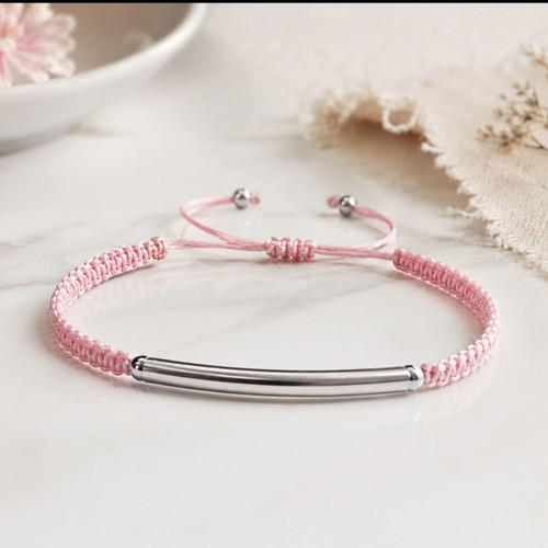 Macrame bracelet with silver steel element, pink cord