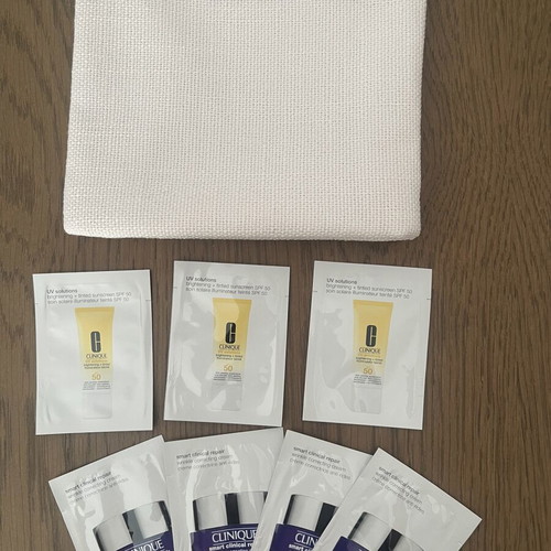 Clinique skincare set new with samples and cosmetic pouch