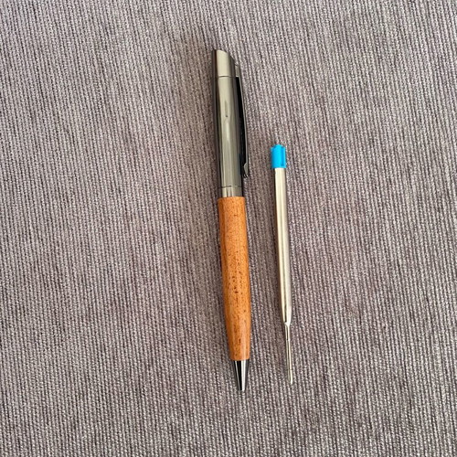 Pen new with black ink and spare blue ink refill