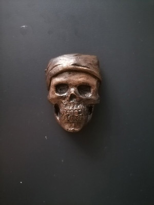 Handmade magnet made of white cement, acrylics, metal spray and varnish
