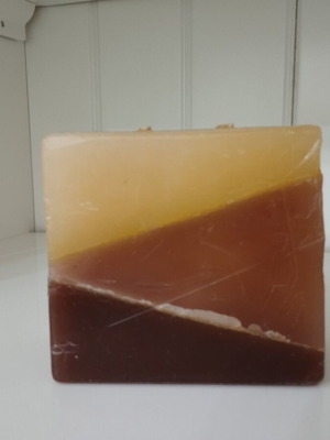 Handmade decorative candle used with layered minimal design